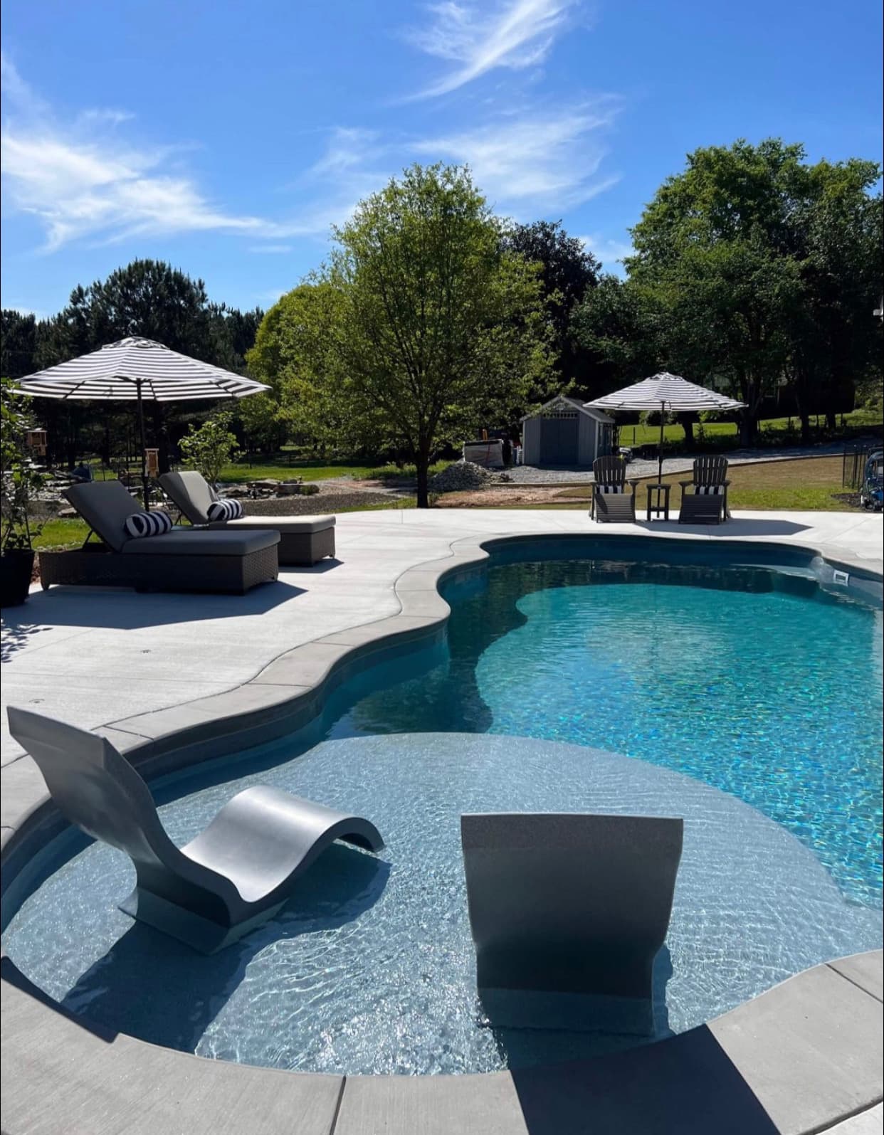 Pergola and patio integrated into a complete outdoor living plan.