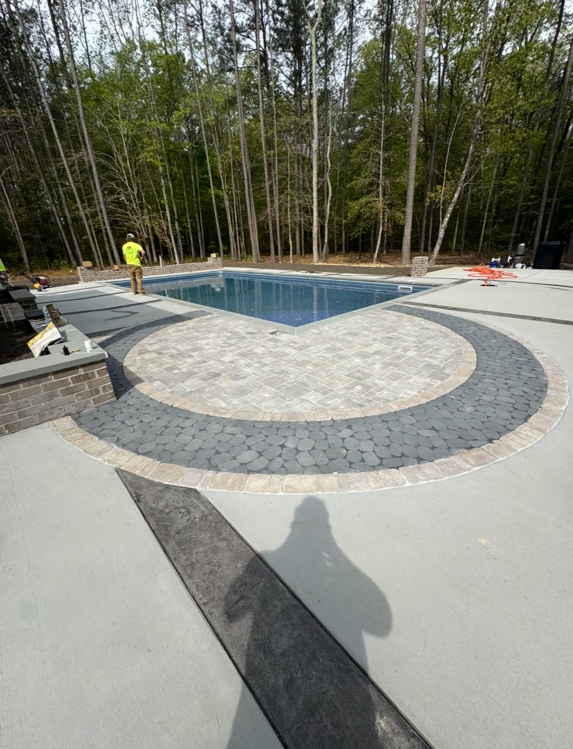 Luxury backyard pool installation with integrated water features.