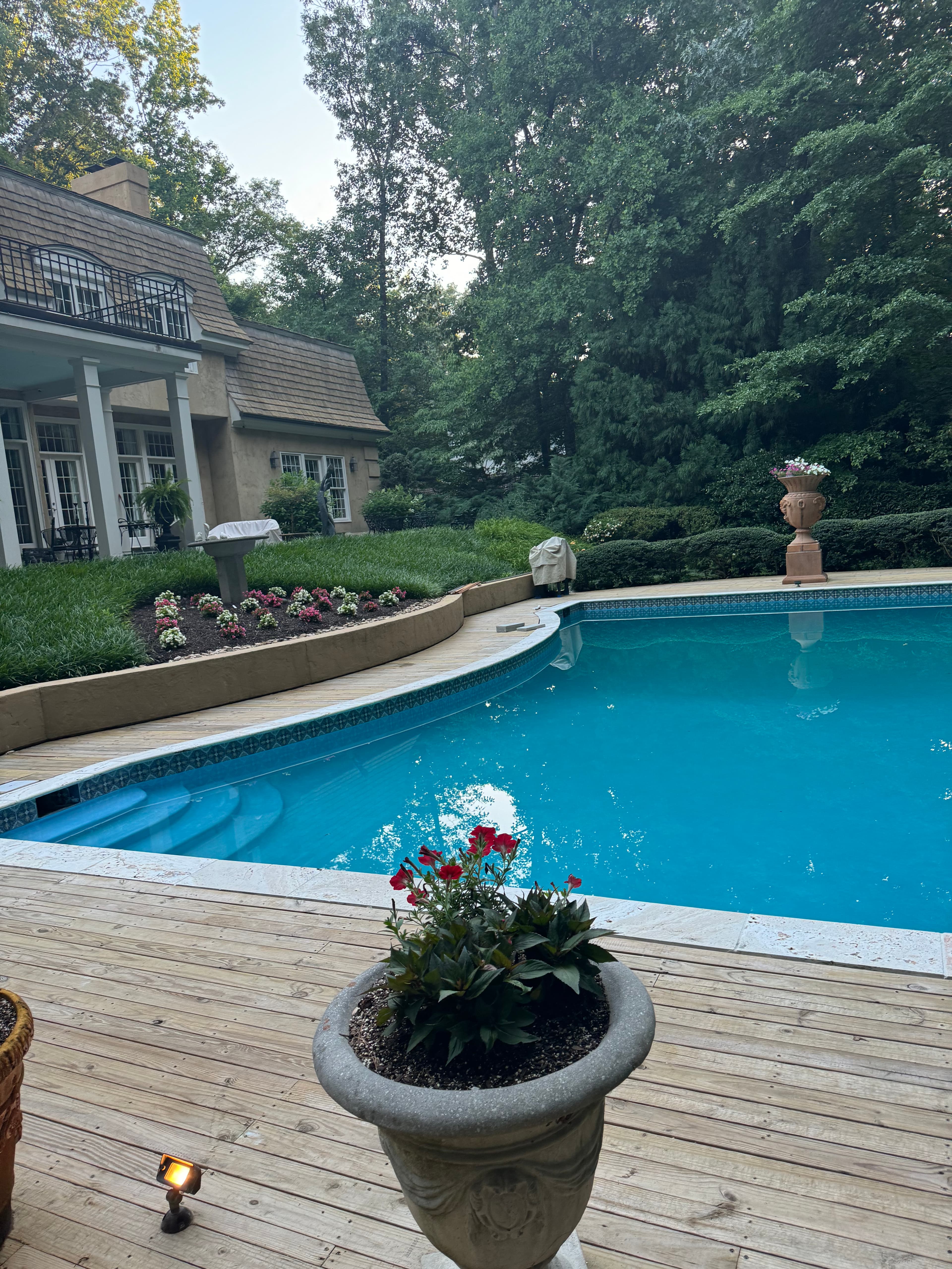 Completed poolscape with water, decking, and lounge space working together.