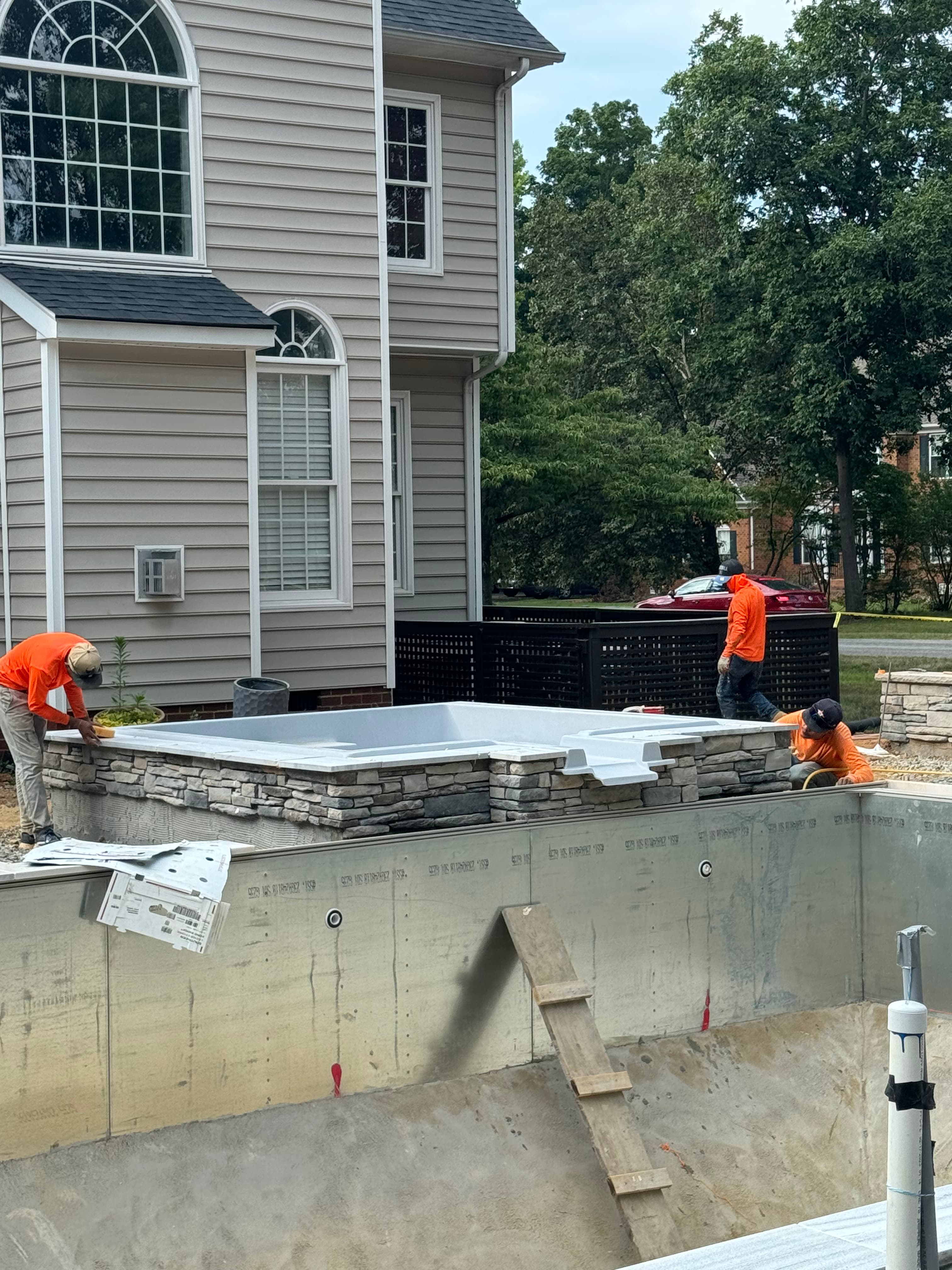 Commercial pool construction with coordinated deck and equipment planning.