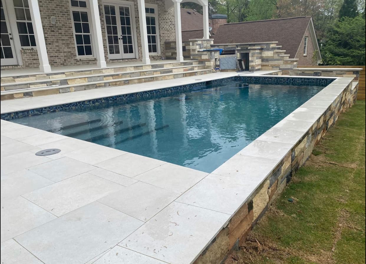 Geometric pool with crisp lines and a structured deck.
