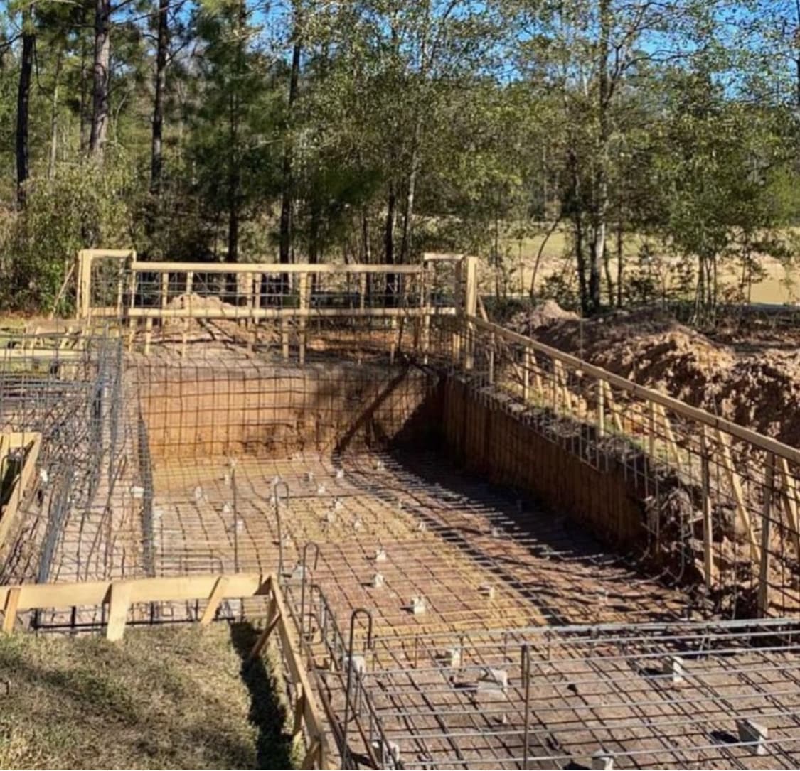 Integrated backyard pool and hardscape composition.
