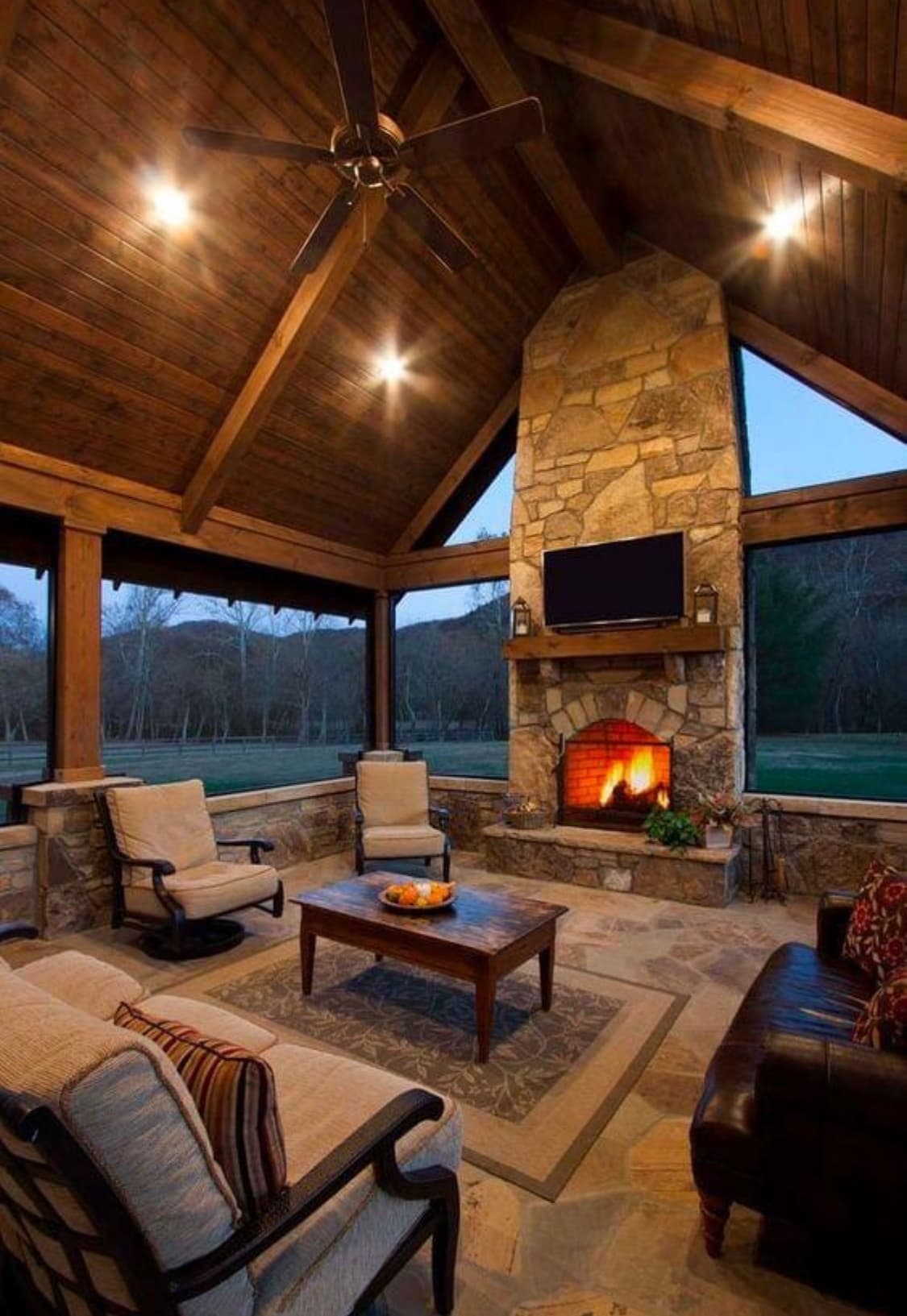 Premium stone patio and hardscape bordering a custom pool.